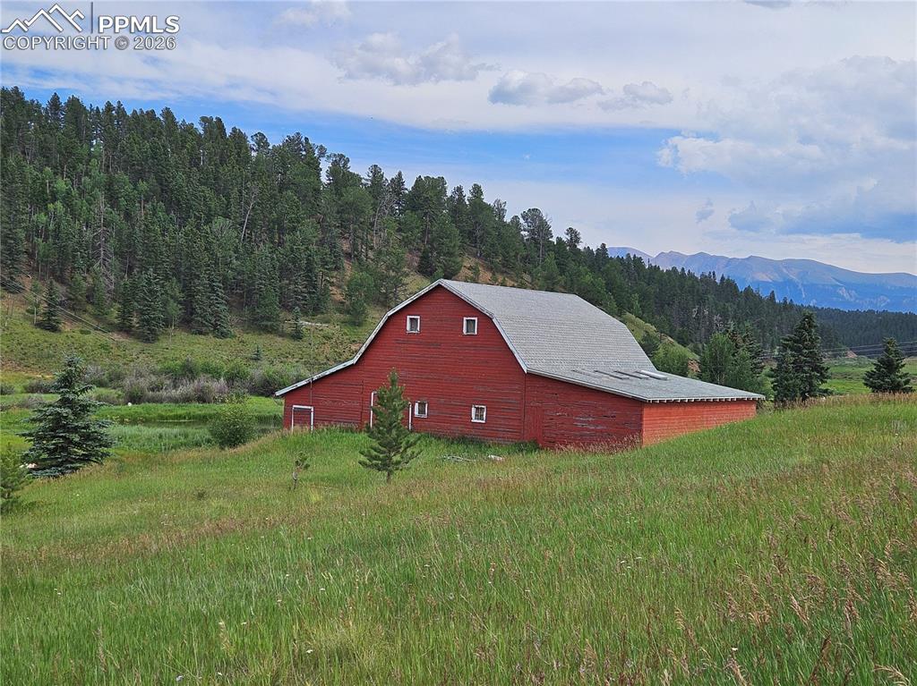 Image 43 of 47: View From Main Community Lake with Pikes Peak in the Background.