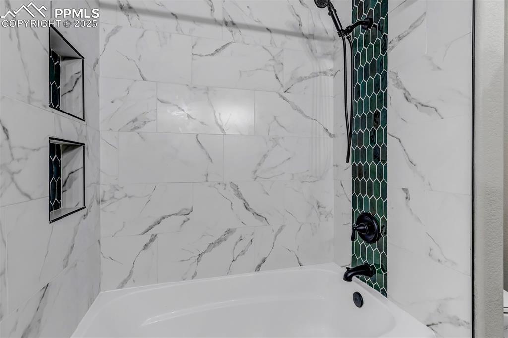 Image 19 of 46: Bathroom featuring bathing tub / shower combination