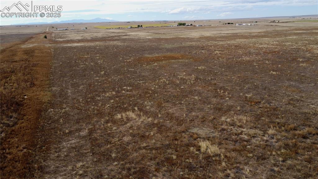 Image 13 of 21: View of yard with a view of rural / pastoral area and a mountain view