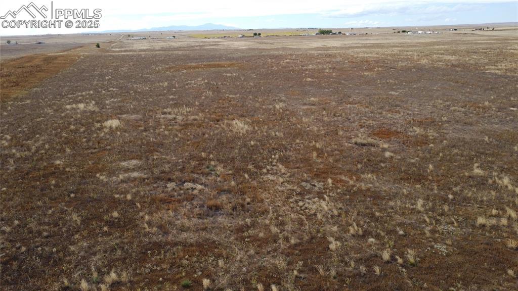 Image 17 of 21: View of rural area with a mountainous background