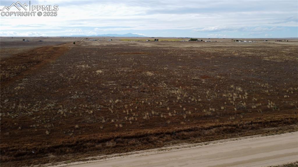 Image 3 of 21: View of rural area featuring a mountain backdrop