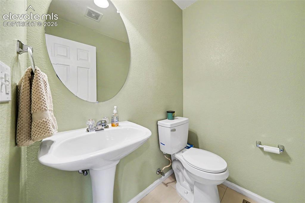 Image 13 of 26: Main Floor Powder Room