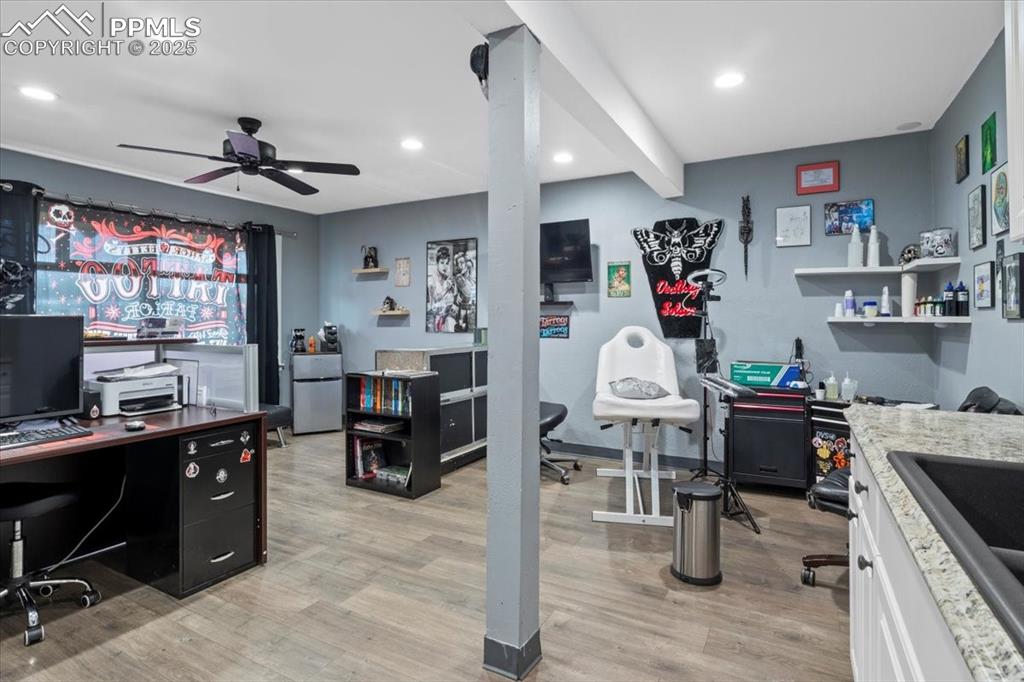 Image 5 of 14: 2nd Unit- Office area featuring ceiling fan, light wood-style flooring, and