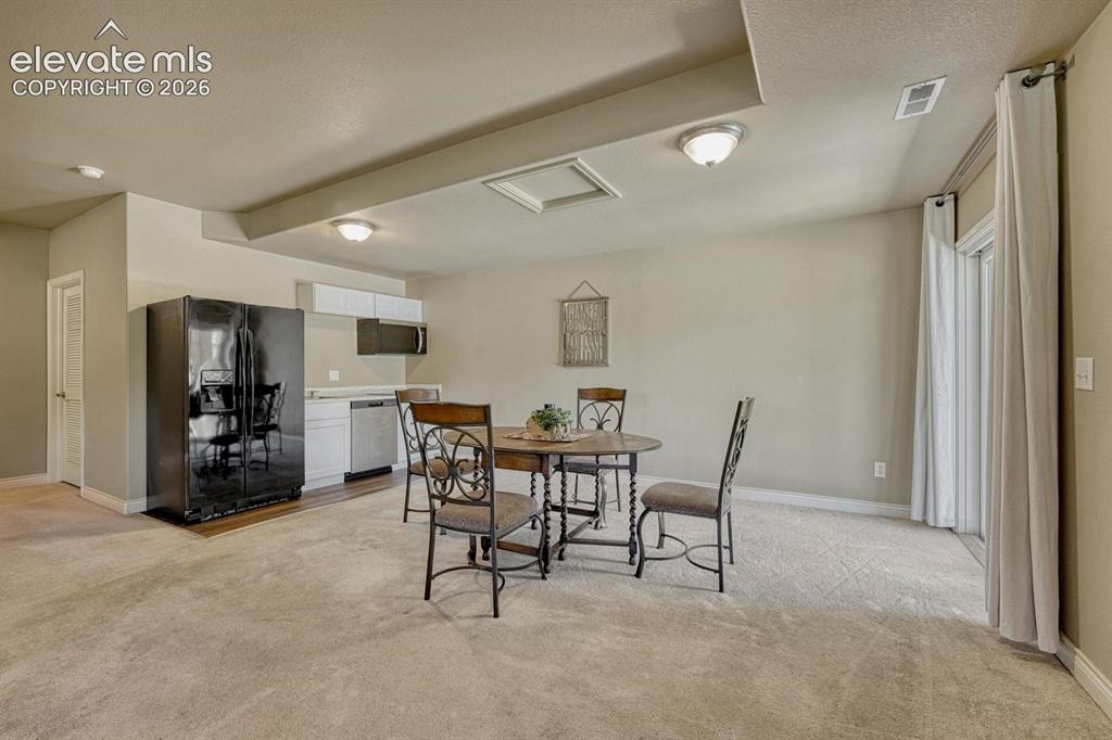 Image 32 of 41: Dining area in lower level living space
