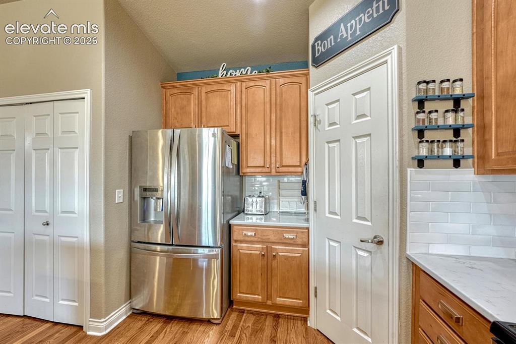 Image 9 of 41: Kitchen and view of pantry
