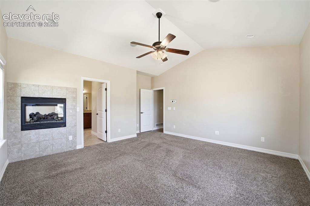 Image 14 of 50: Spacious Primary Suite w/see-through gas fireplace