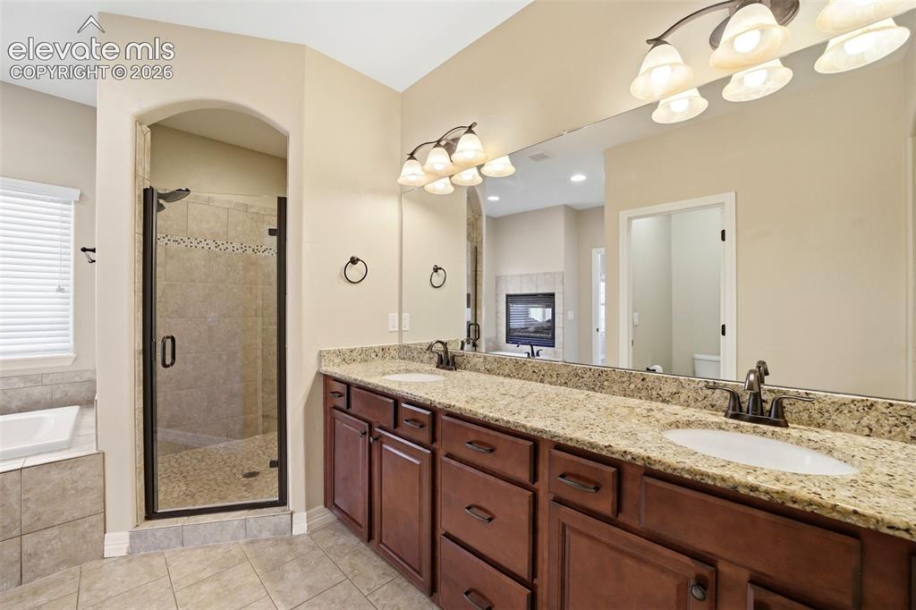 Image 19 of 50: Double vanity with plenty of counter space, drawers and cabinets