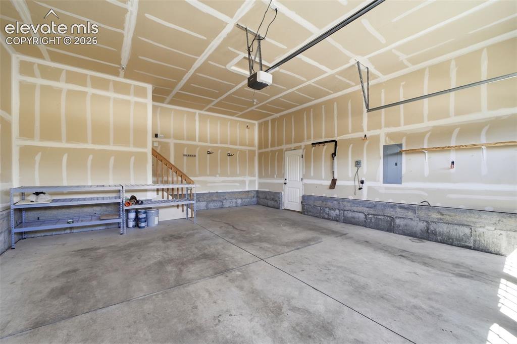 Image 46 of 50: Oversized 2-car garage w/opener