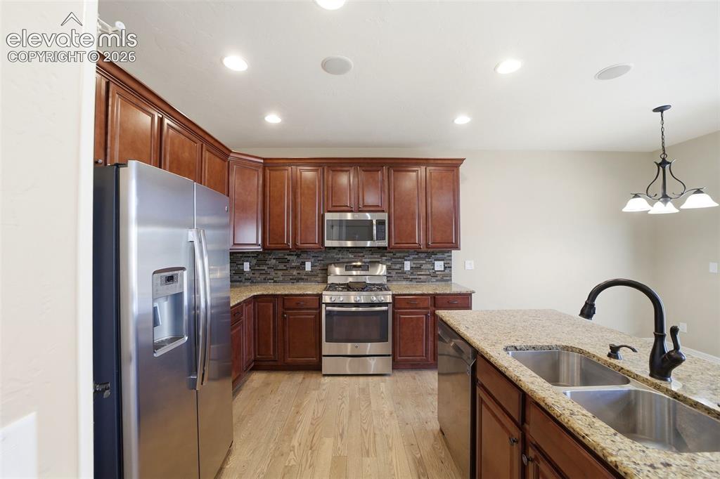 Image 6 of 50: Beautiful kitchen with upgraded appliances