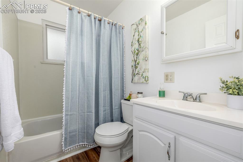 Image 11 of 36: Full bathroom with shower / bathtub combination new vinyl plank wood-look f