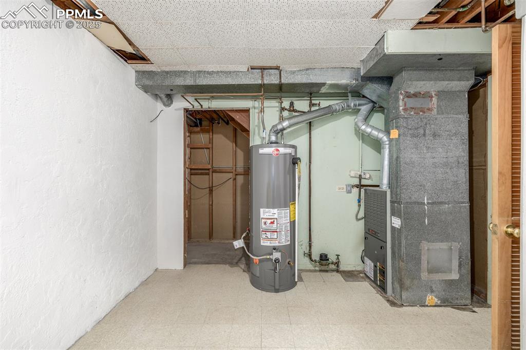 Image 20 of 36: New water heater (2024) and recently serviced furnace