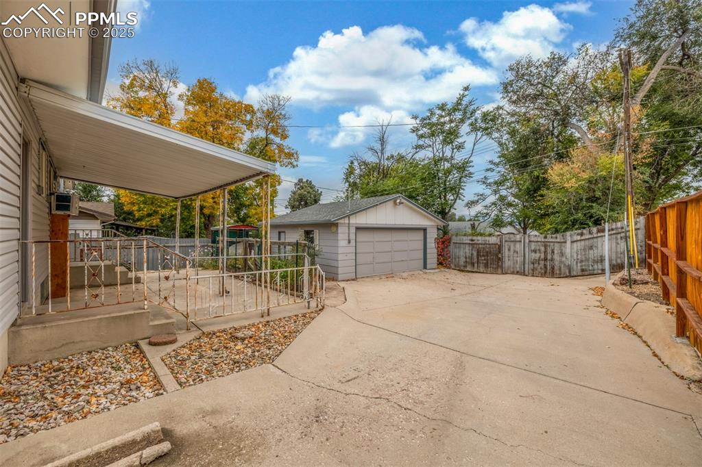 Image 21 of 36: Driveway to the BONUS oversized 2-car garage