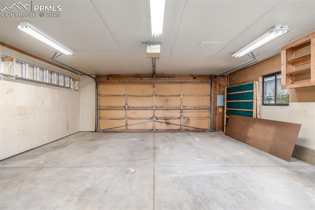 Image 23 of 36: Oversized 2-car garage has a brand new electrical subpanel.