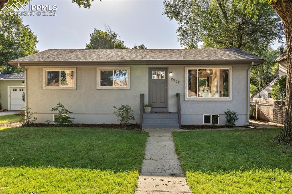 Image 2 of 39: View of front of house with stucco siding