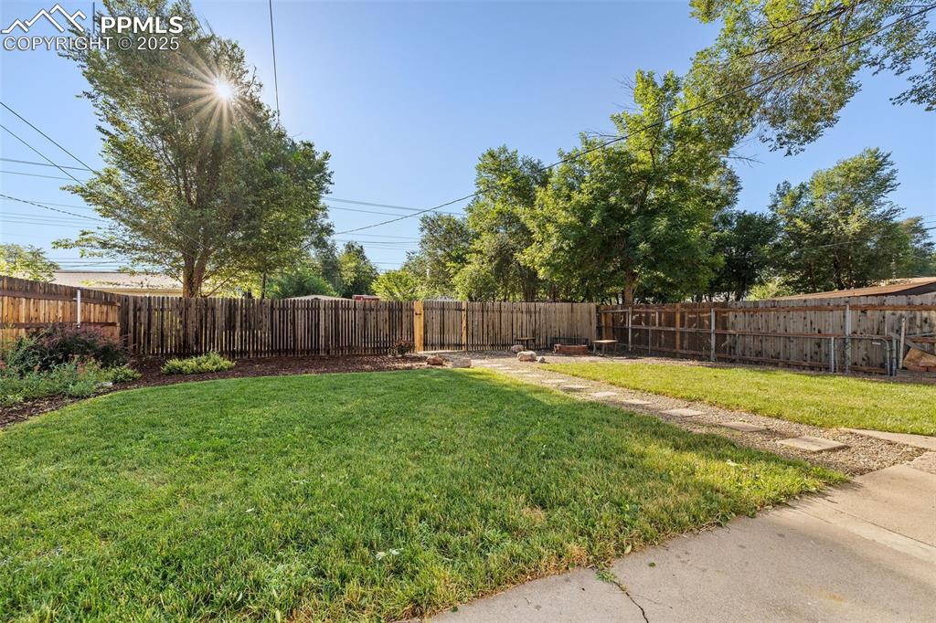 Image 35 of 39: View of fenced backyard