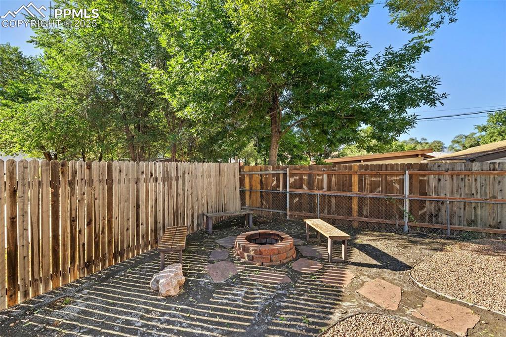 Image 37 of 39: View of patio / terrace with a fire pit