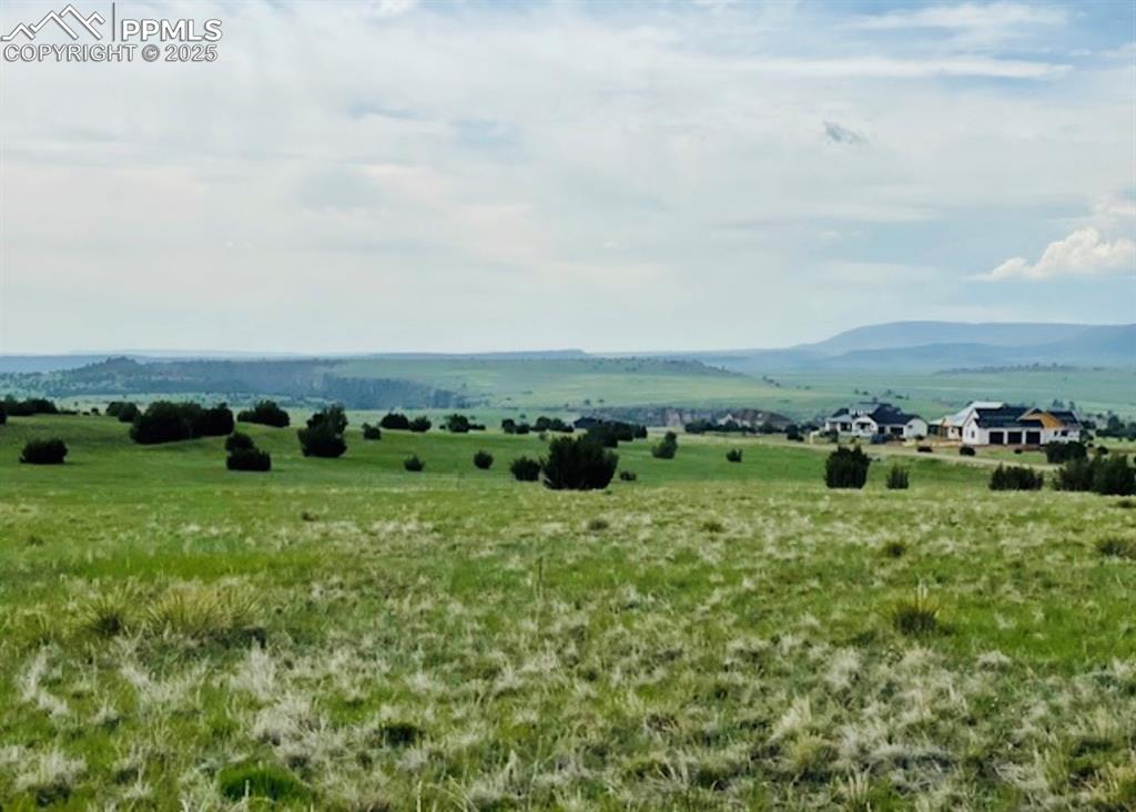 Image 3 of 4: View of mountain backdrop featuring rural landscape