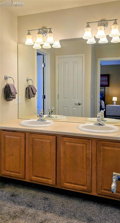 Image 30 of 37: Full bath featuring double vanity and ensuite bath