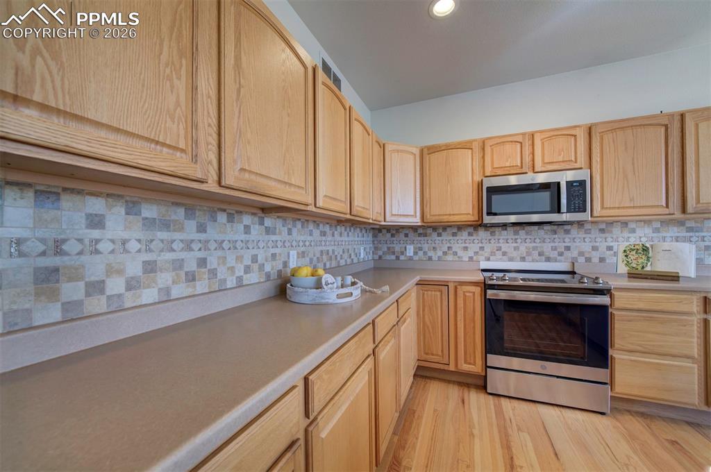 Image 13 of 39: lots of counterspace and cabinets