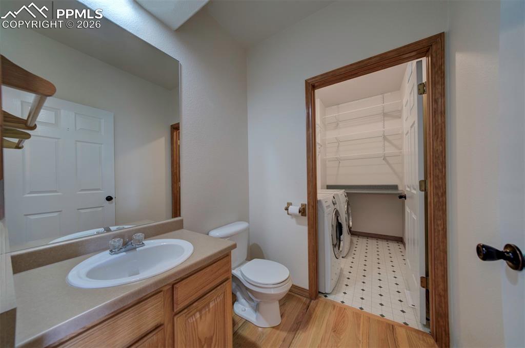 Image 15 of 39: main floor 1/2 bath and laundry