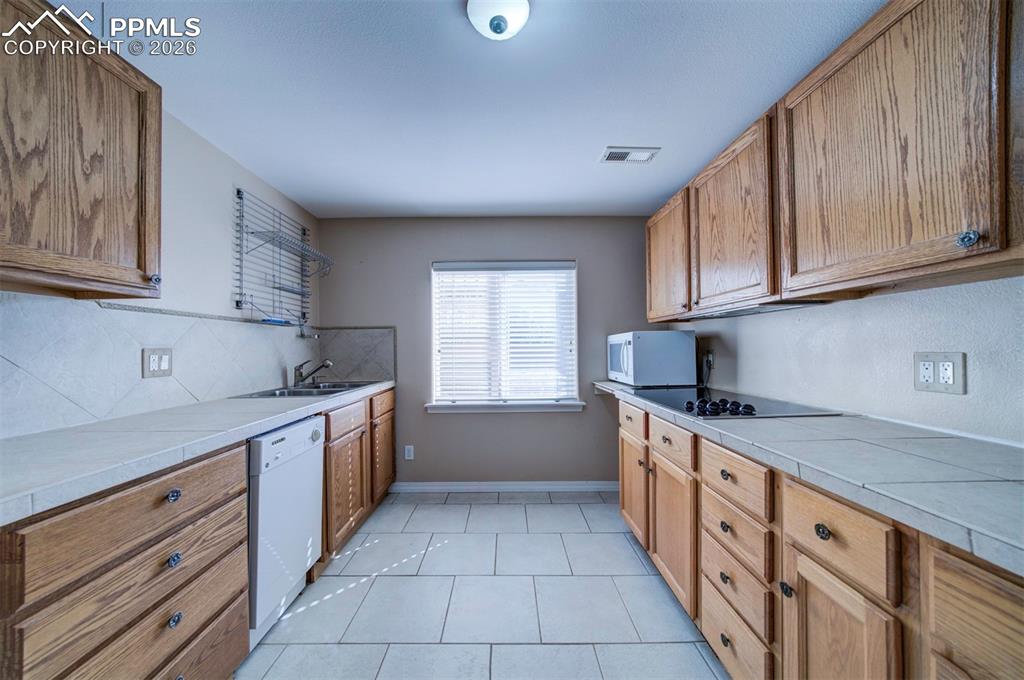 Image 26 of 39: 2nd Full Kitchen