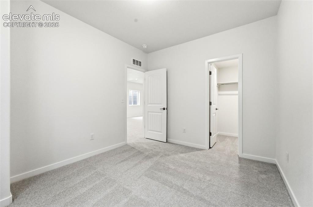 Image 24 of 29: Basement Bedroom w/ WIC