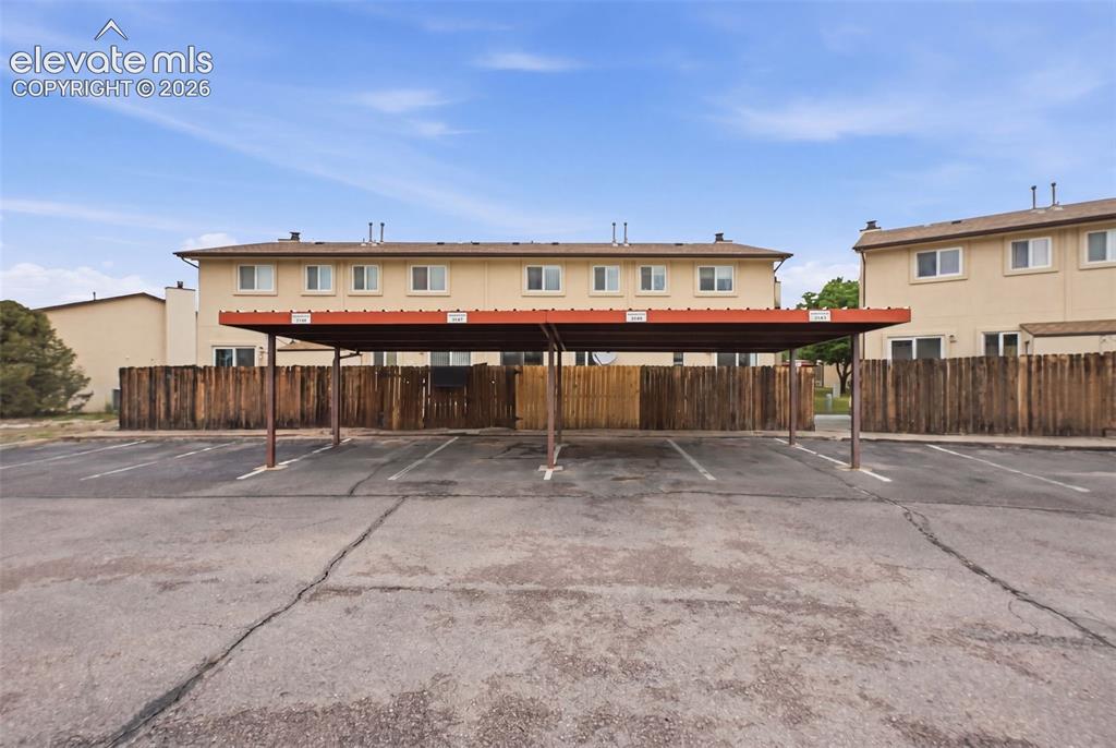 Image 26 of 27: With assigned carport