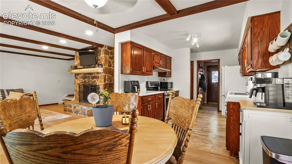 Image 18 of 40: Dining area and galley kitchen.
