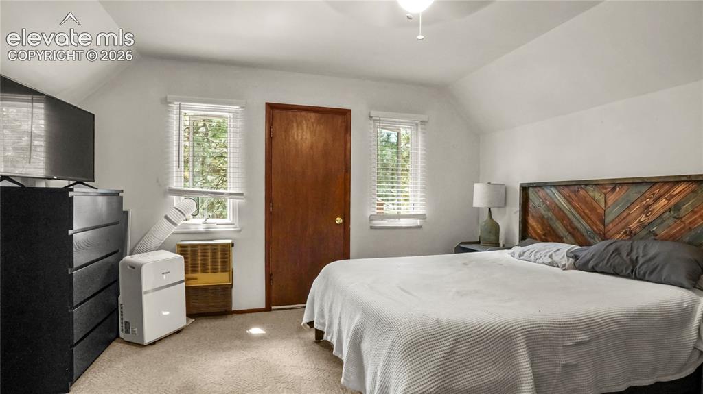 Image 30 of 40: Upstairs Master Bedroom with a walk out to the separate balcony.