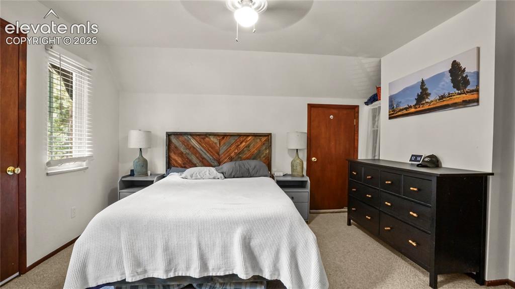 Image 31 of 40: Upstairs Master Bedroom with a walk out to the separate balcony.