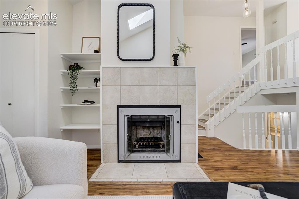 Image 6 of 39: Wood burning fireplace. 