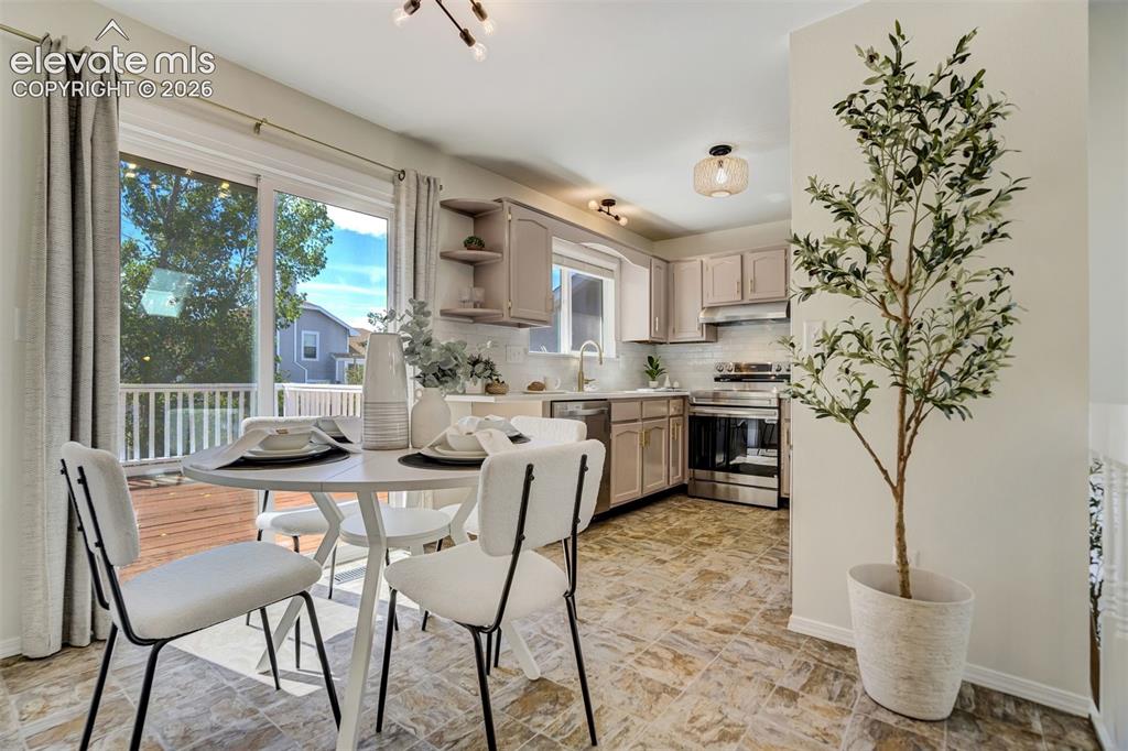 Image 9 of 39: Dining space off the kitchen. 