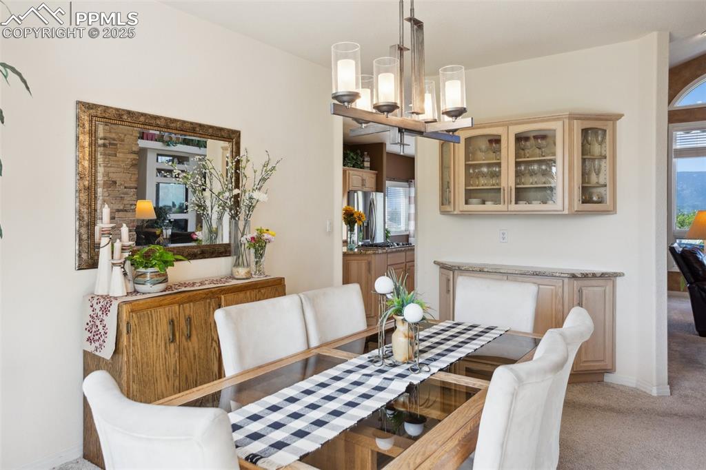 Image 9 of 49: Spacious Dining Room Opens to Kitchen and Great Room!