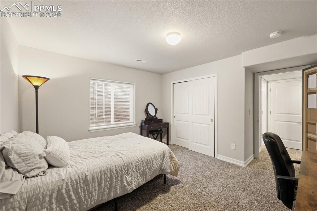 Image 30 of 39: Basement Bedroom 5 