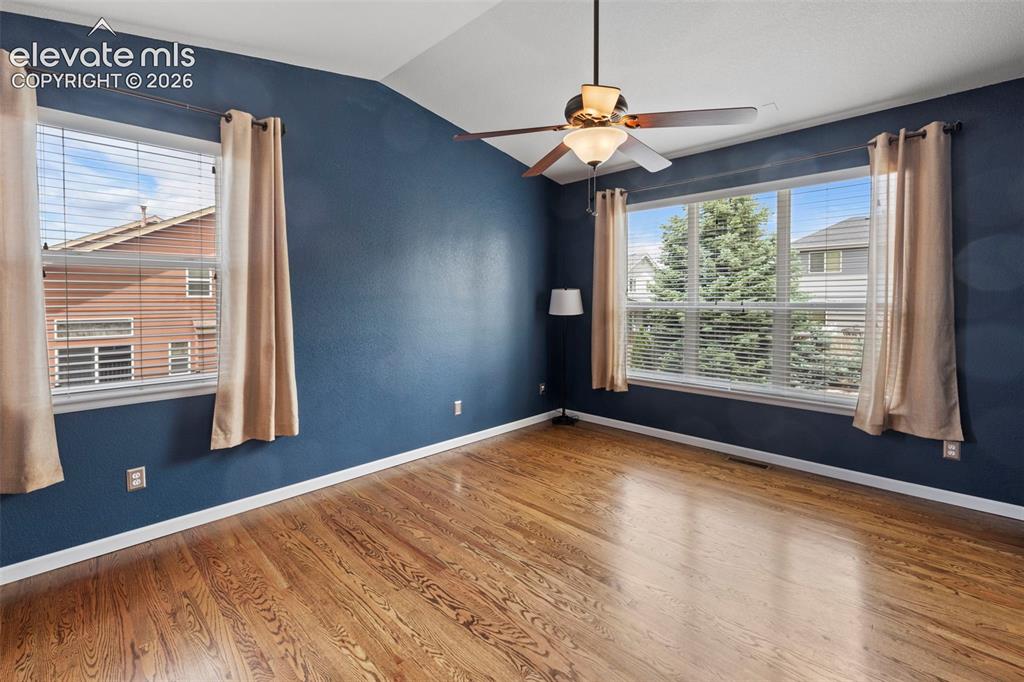 Image 12 of 50: Private Master Suite on main level with soaring ceilings, large windows and