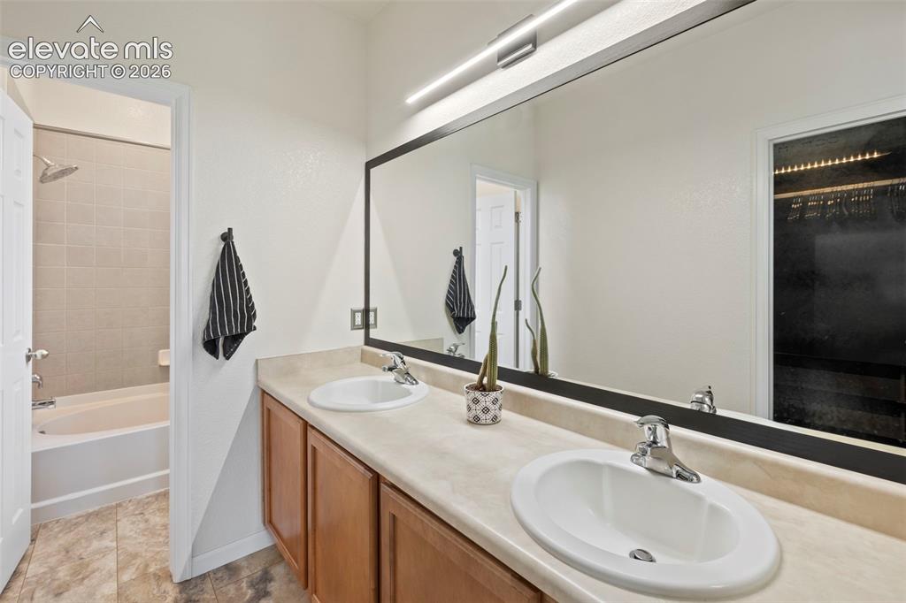 Image 14 of 50: Attached master bathroom with brand new flooring and paint