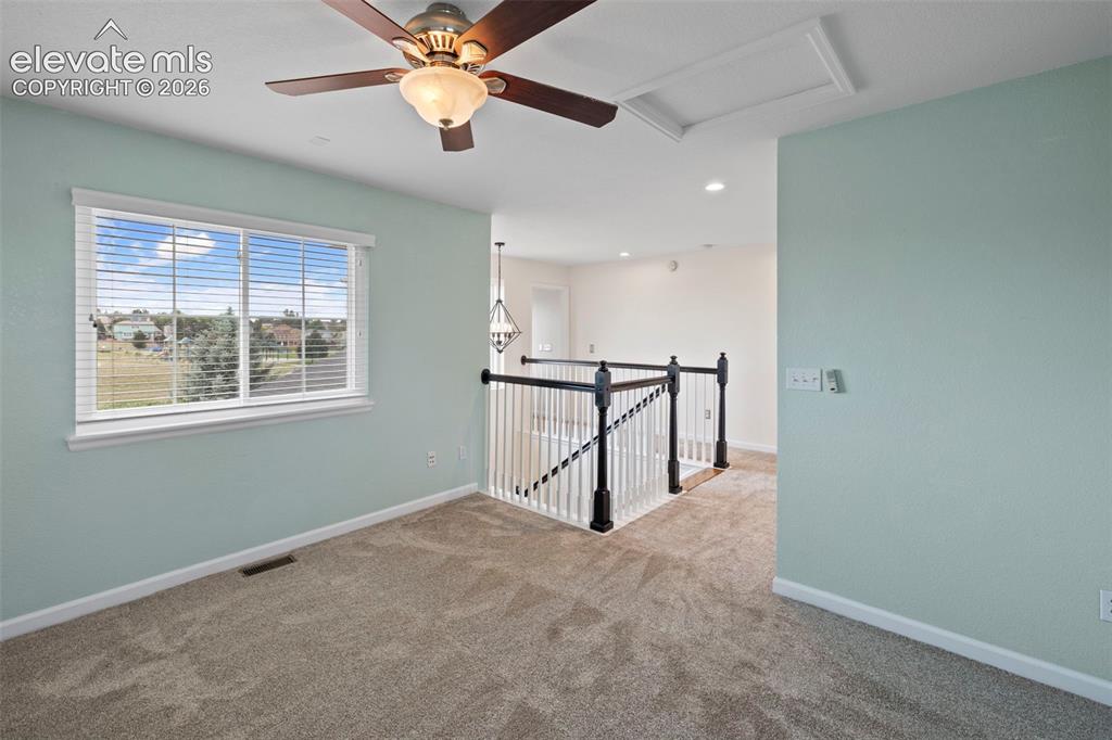 Image 18 of 50: Loft upstairs that can be used for an office space or additional family roo