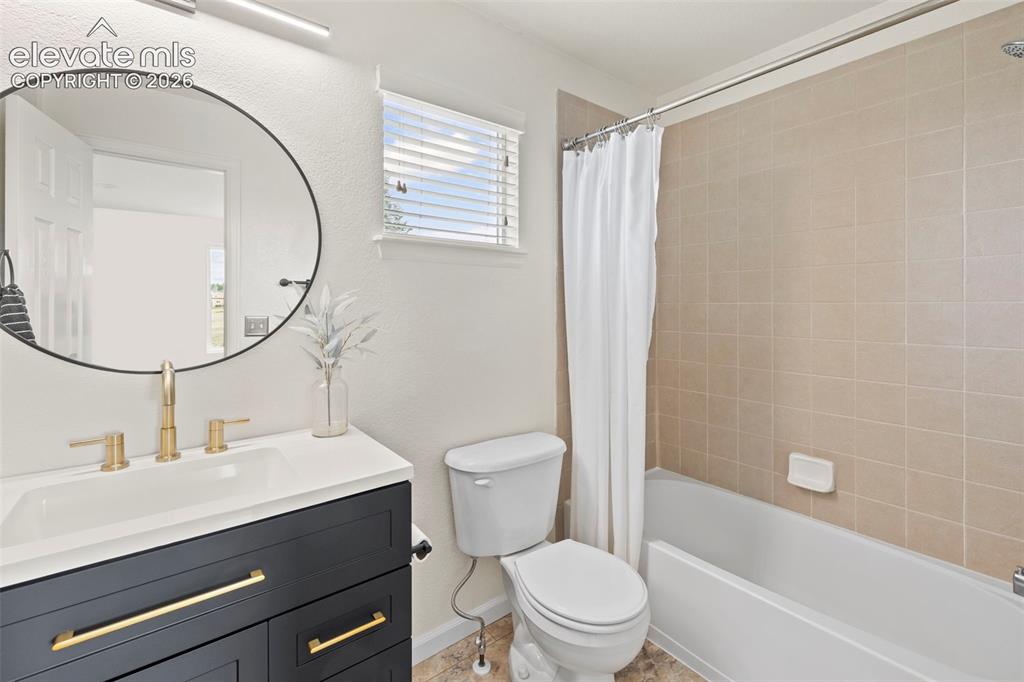Image 23 of 50: Recently renovated upper level bathroom with new flooring and tile shower s