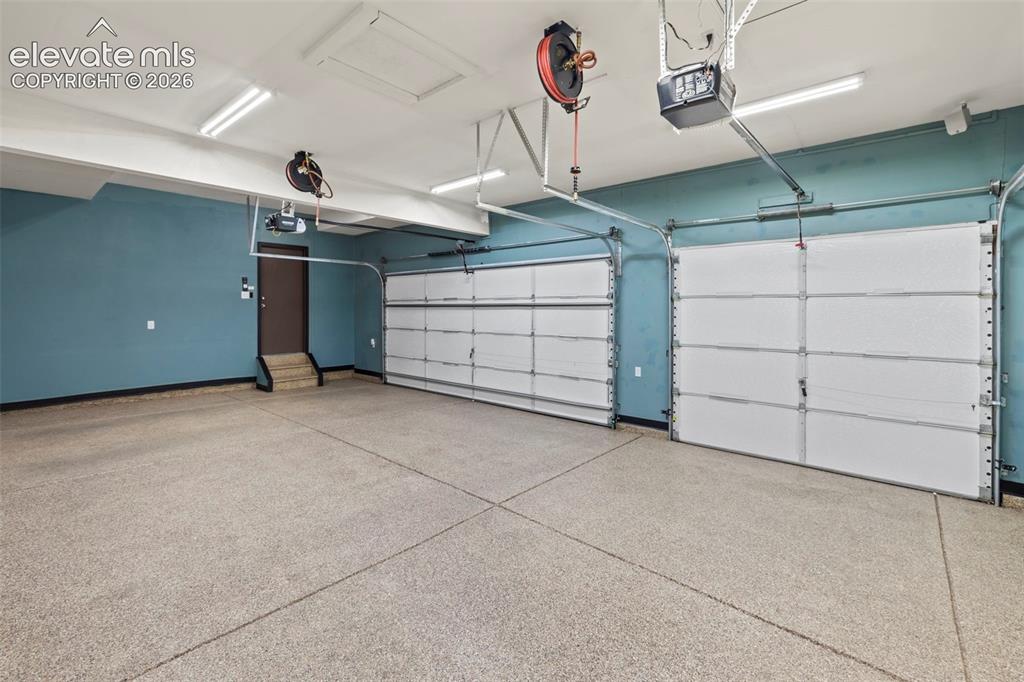 Image 41 of 50: Finished and insulated 3-car garage with epoxied floors