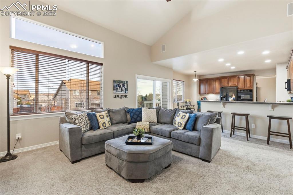 Image 14 of 46: Family area opens onto kitchen for easy flow