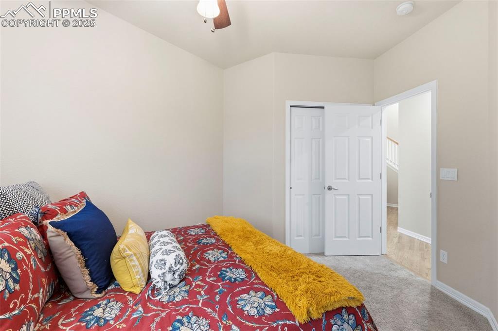 Image 18 of 46: Bedroom featuring light colored carpet and ceiling fan