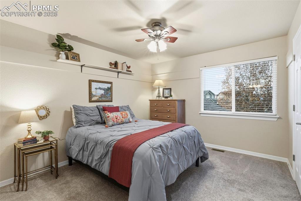 Image 25 of 46: Bedroom featuring carpet floors and ceiling fan