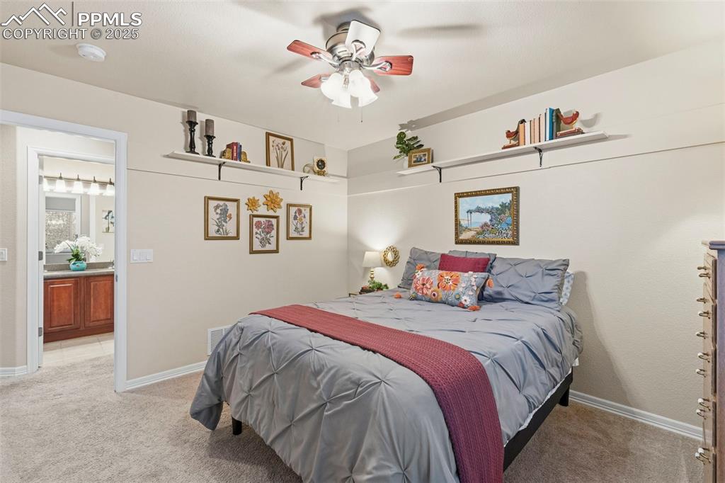 Image 26 of 46: Bedroom featuring ceiling fan and carpet