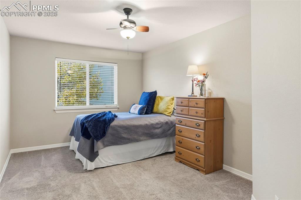 Image 28 of 46: Bedroom featuring light colored carpet and a ceiling fan