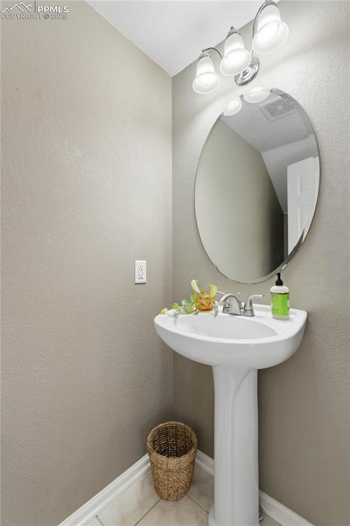 Image 17 of 38: Half bath on main floor