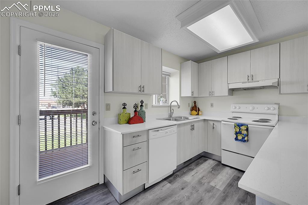 Image 5 of 20: Updated kitchen walkout to deck