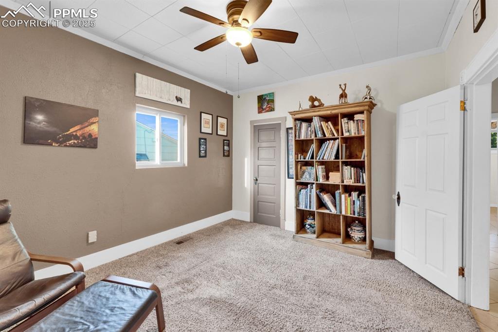 Image 10 of 24: Bedroom 1 featuring a ceiling fan