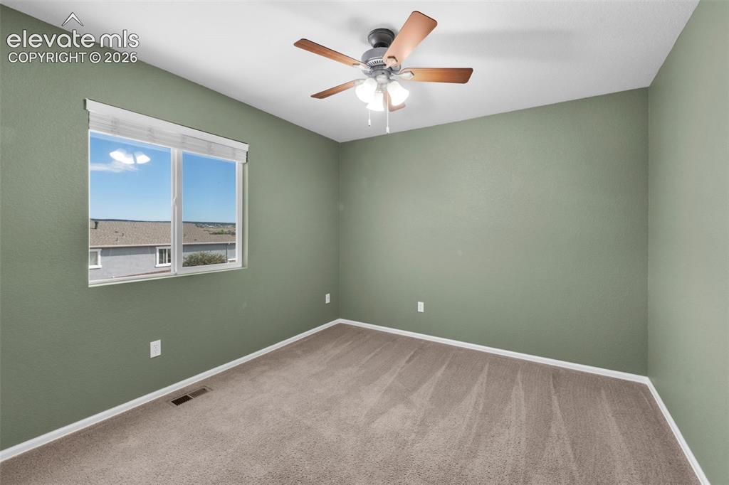 Image 16 of 41: Secondary bedroom offers flexible space for sleeping, work or hobbies.