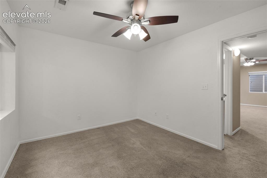 Image 18 of 41: Finished lower-level bedroom provides additional private living or guest sp