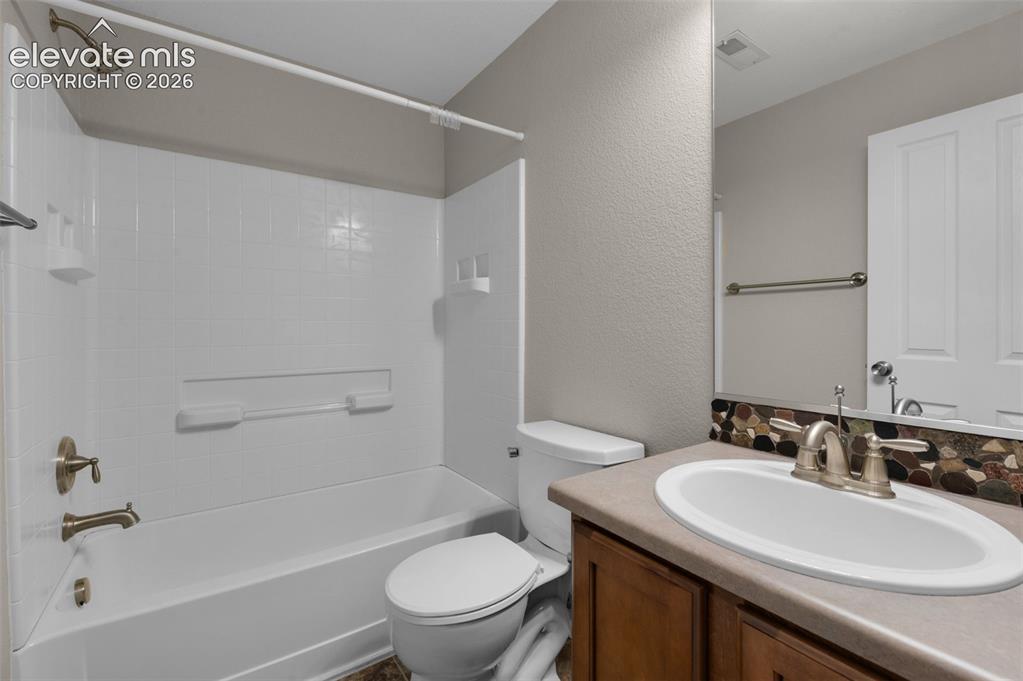 Image 33 of 41: Full basement bathroom adds flexibility for guests and lower-level living.